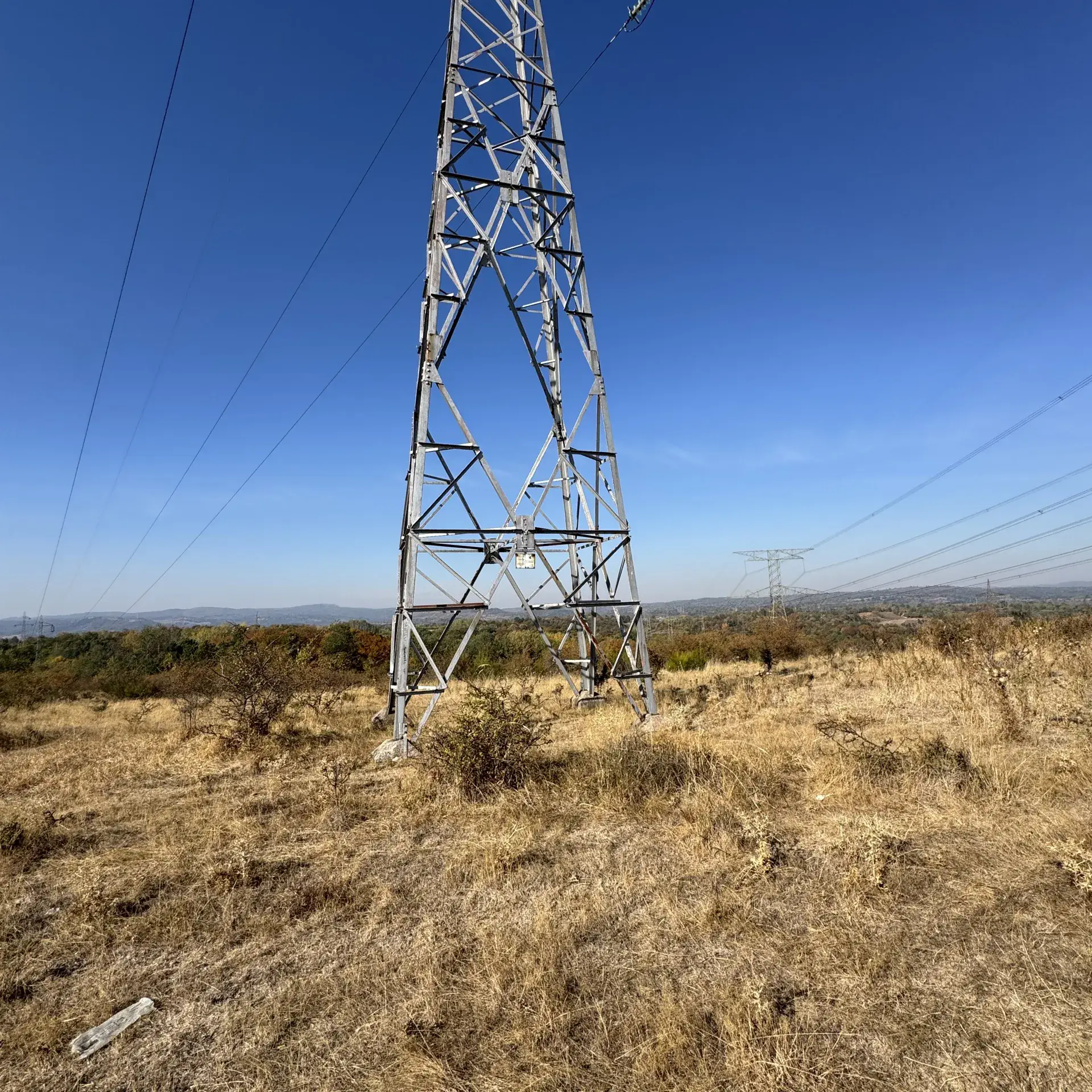 Transmission tower on the RES1 parcel, with the grid corridor beyond